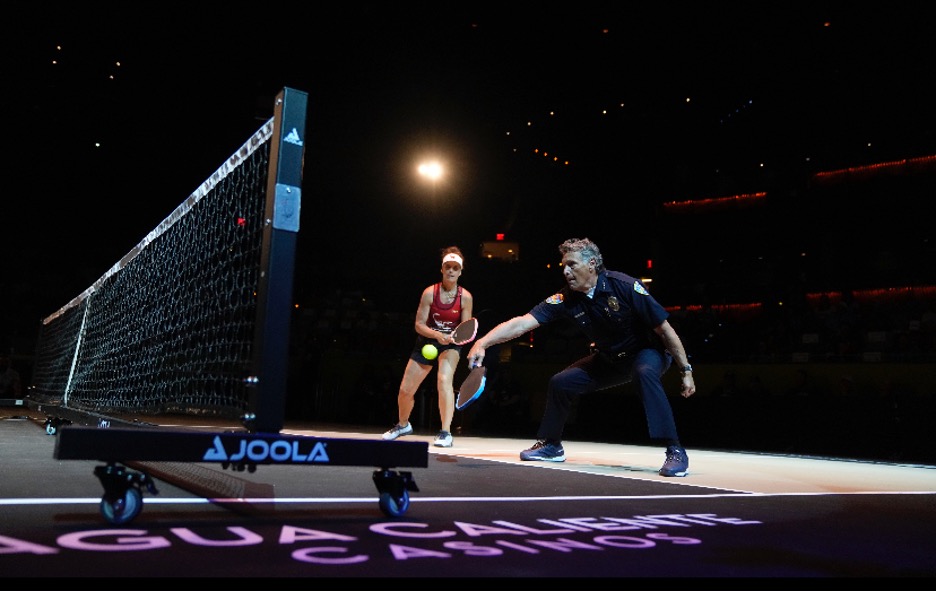 Chief Mills playing pickleball at a charity event with the local professional team, the Scorpions.