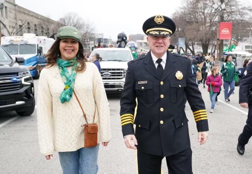 Chief Tracy and his wife Brenda marching in a parade in St. Louis.